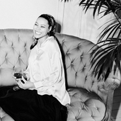 woman smiling on sofa
