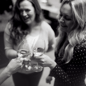 wine glasses being held by people
