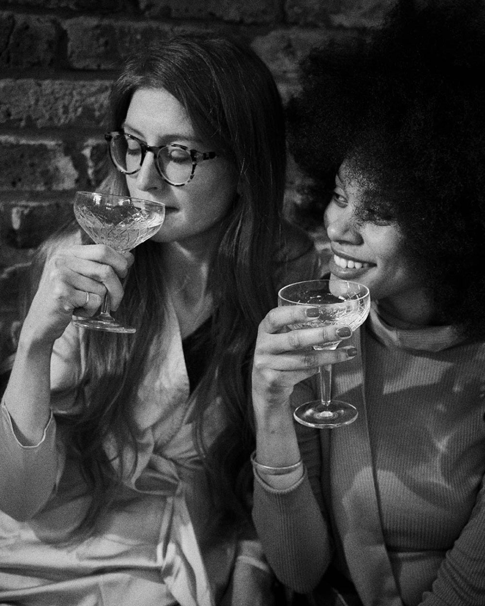 people holding wine glasses