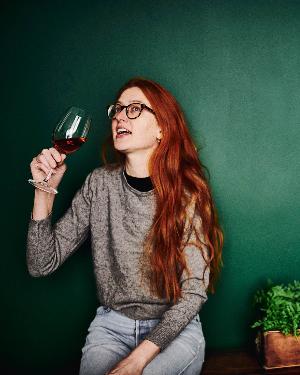 Person holding wine glass